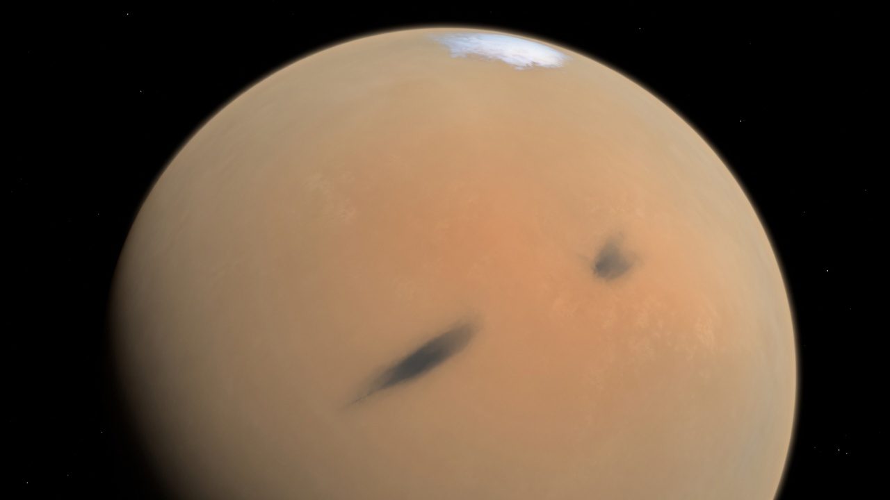 Illustration of Mars as a dusty ochre disk, with a bright polar area.