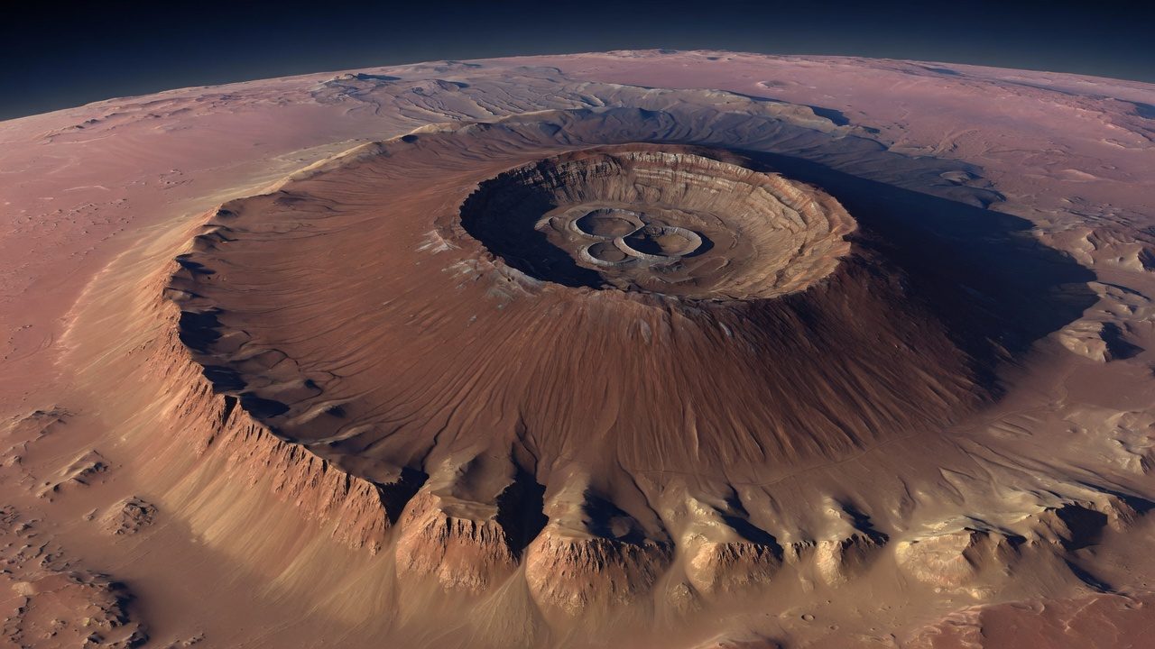 Illustration of a broad volcanic mountain with nested summit craters and a steep outer cliff.